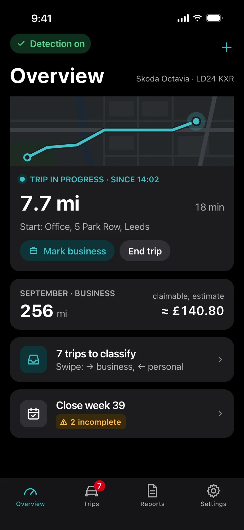 Overview in dark mode while a trip is being recorded: 7.7 miles in 18 minutes, with buttons to mark it as business or end the trip.